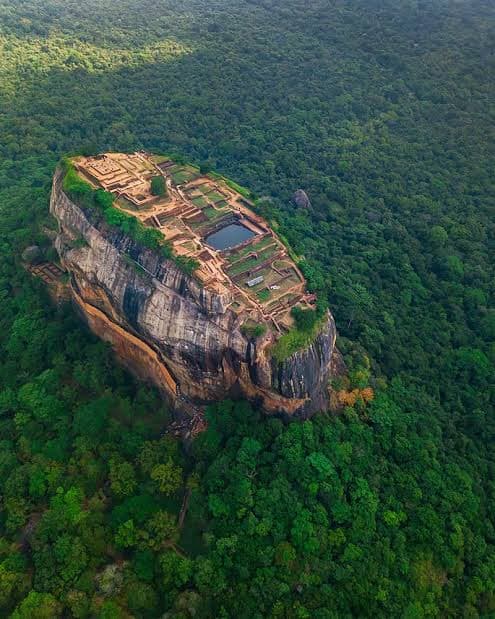 Sigiriya rock fortress rising above the forest